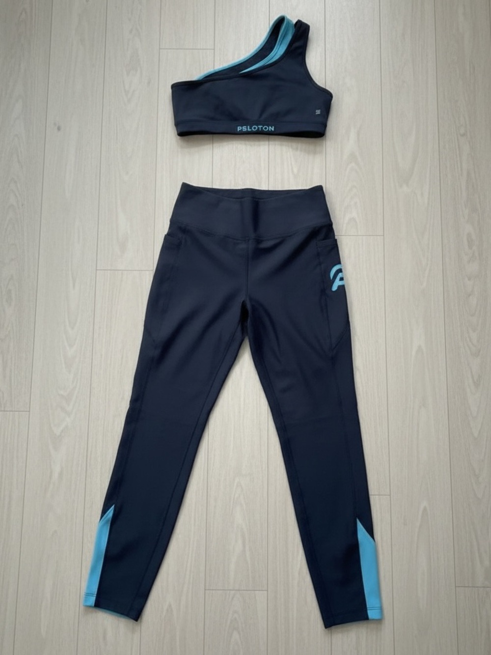 Peloton Black and Teal High-Waist Leggings with Asymmetric Sports Bra